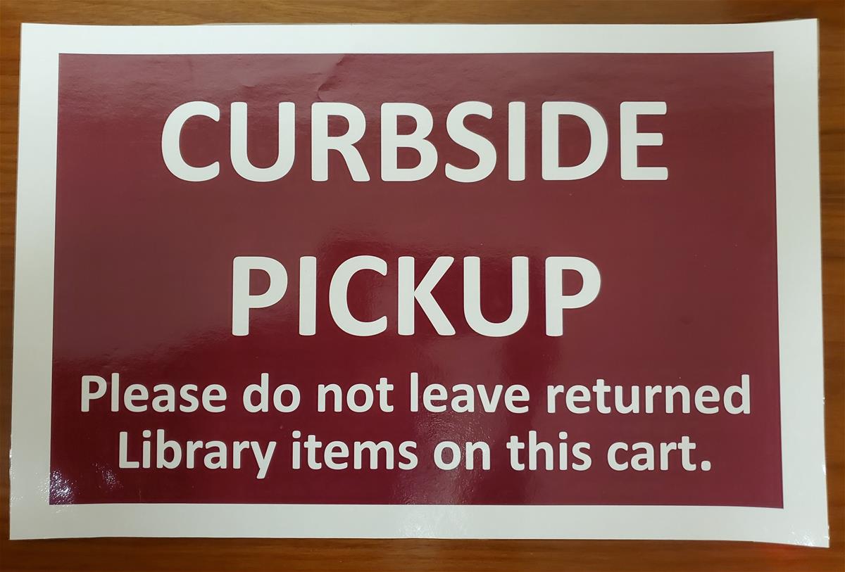 Maroon-colored sign with text 