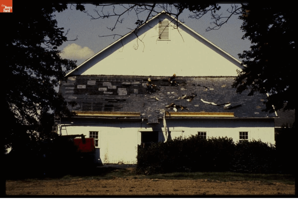 Disassembly of Firestone Barn GIF that cycles through four images of deconstructing a barn, from the full building down to the beam structure
