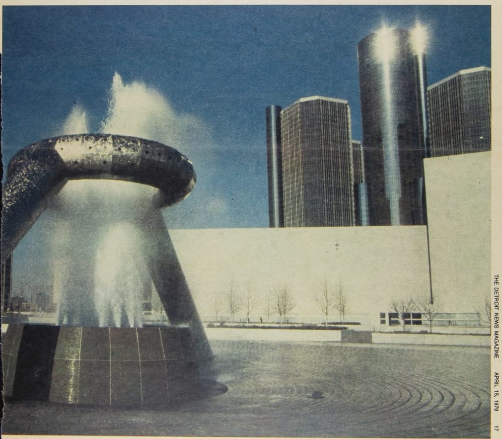 https://www.thehenryford.org/collections-and-research/digital-collections/artifact/512678#slide=gs-566604 Silver fountain with large elevated silver circle through which water spouts; buildings in background