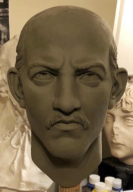 Sculpture of Spider Huff's head Head of man with receding hairline, mustache