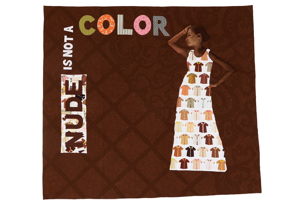 Brown quilt with quilted text 