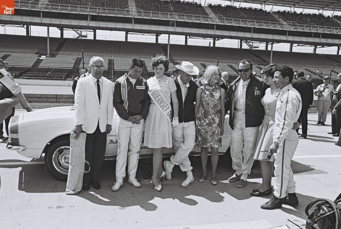 indianapolis50005-67_0553 Roger McCluskey, Lloyd Ruby, A.J. Foyt and Mario Andretti posing with the Guersney Queen at the Indy 500 1967.