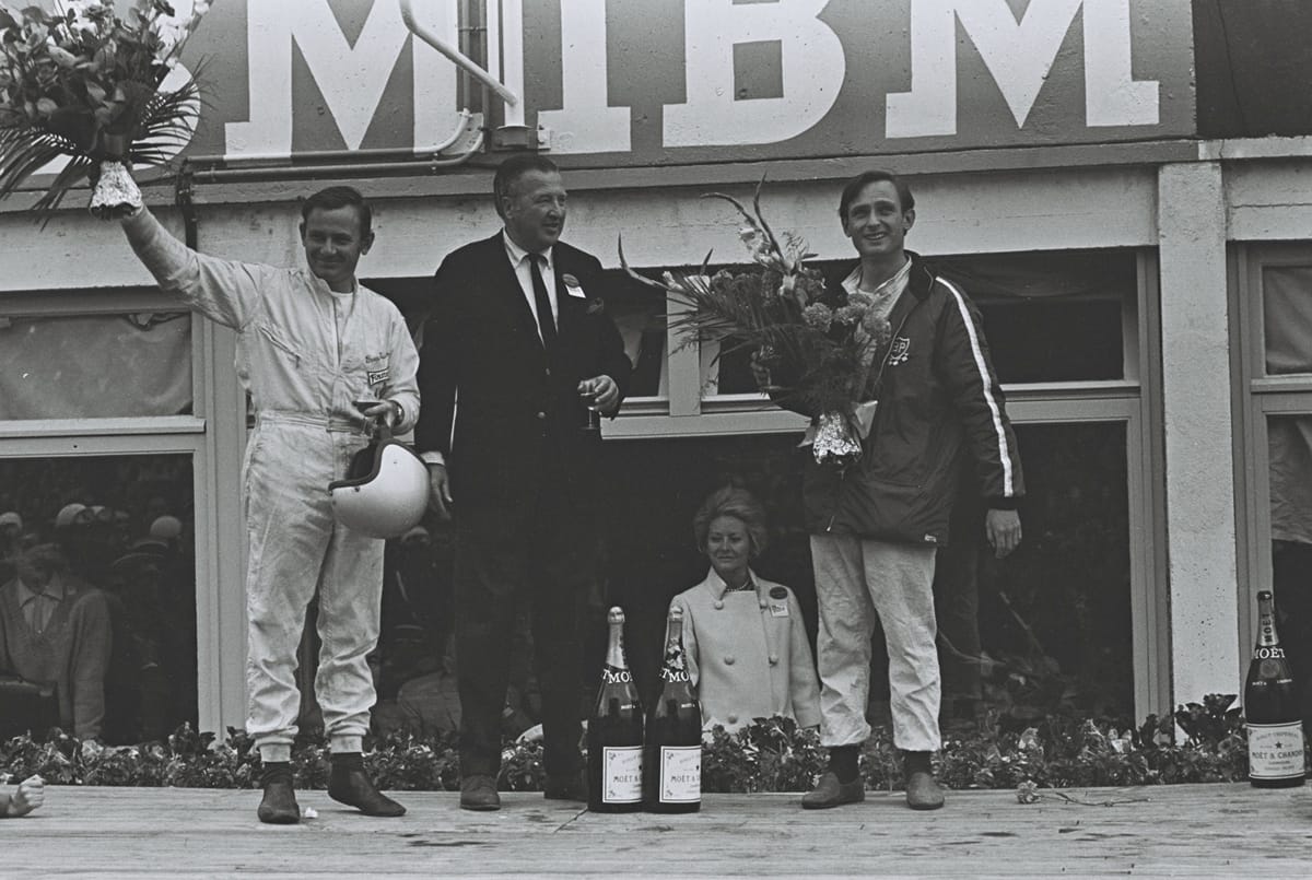 lemans06-66_369 Henry Ford II celebrated with drivers Bruce McLaren (left) and Chris Armon (right) after their victory at Le Mans in 1966.