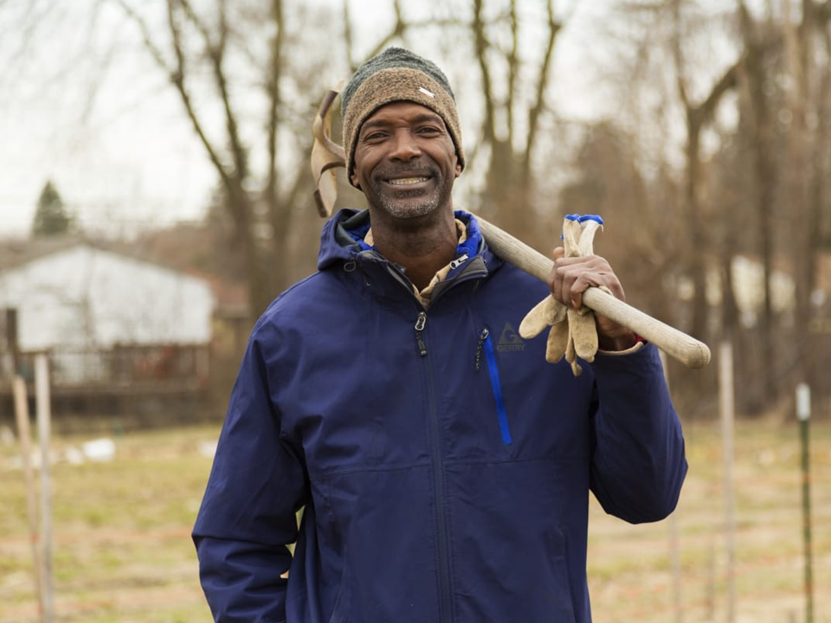 melvin7 Melvin Parson posing with a shovel over his shoulder