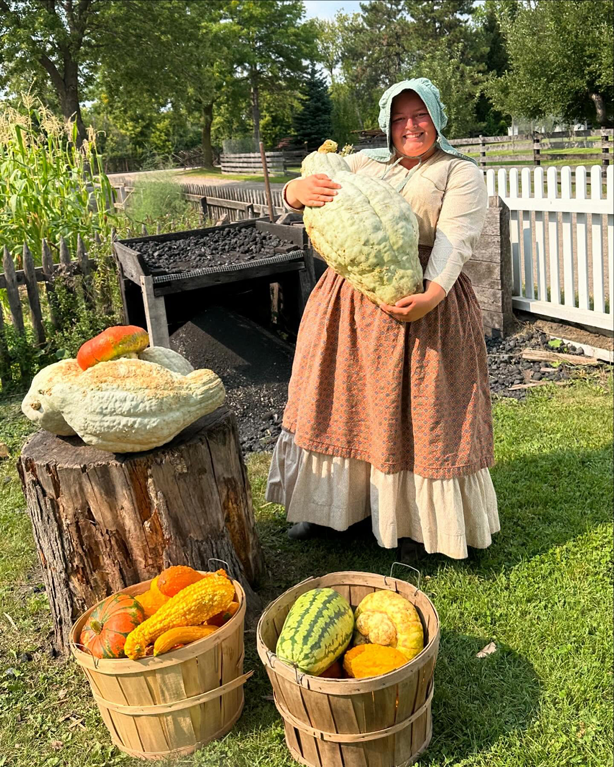 A woman holding a large gourd