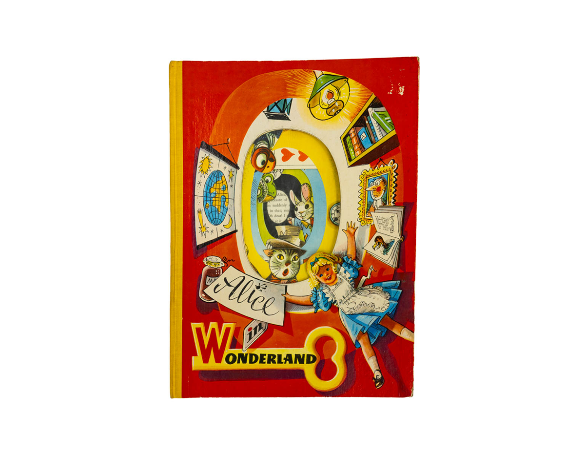 The oval die-cut opening on the cover is lined with cellophane, resembling the rabbit hole down which Alice fell. When closed, the images in the first pop-up are skillfully layered, allowing the reader to view some of the characters without opening the book. Kubašta was known for adding unusual materials, such as cellophane and foil, to his books. /
