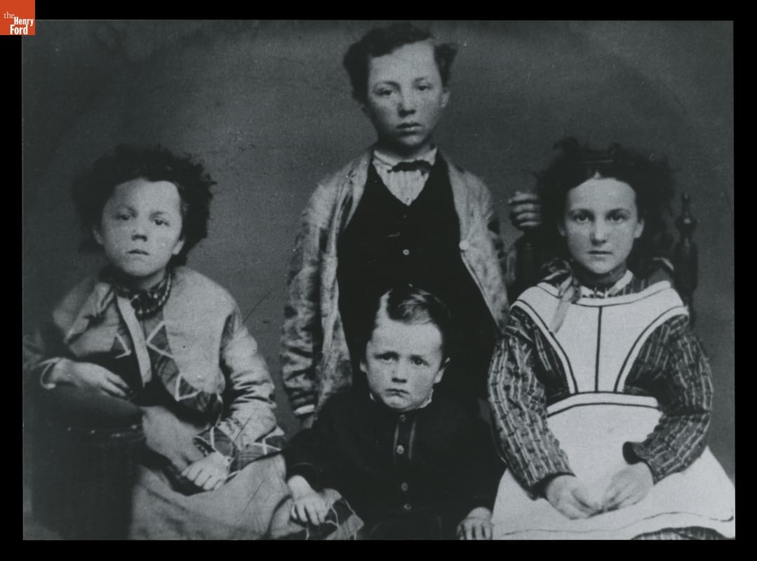Four children with glum expressions