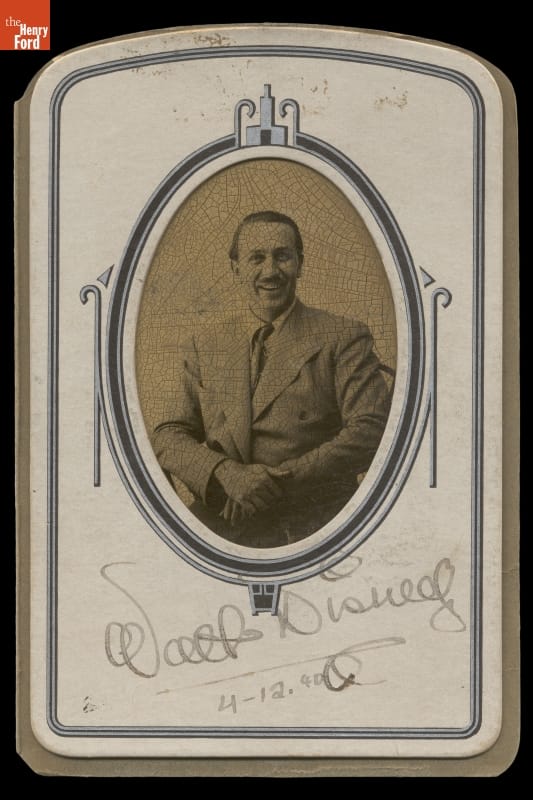 Oval black-and-white portrait of man in suit, matted and signed