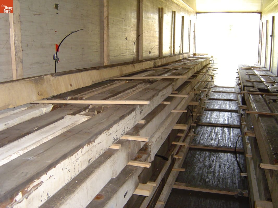 Dismantling the Riding Stable (Originally the Detroit Central Farmer's Market Building) at Belle Isle, Detroit, Michigan, 2003 Long, sturdy timbers are carefully stacked in a truck trailer or storage pod