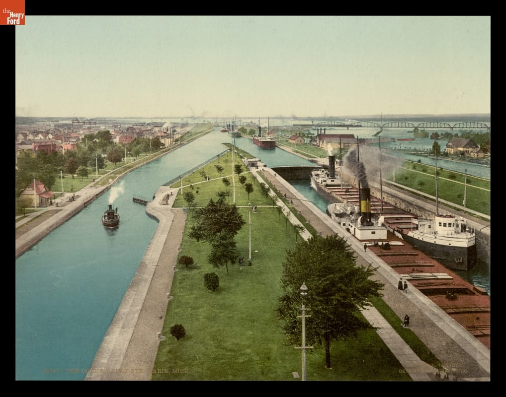 Photochrom Print, Large ships travel through narrow canals with locks