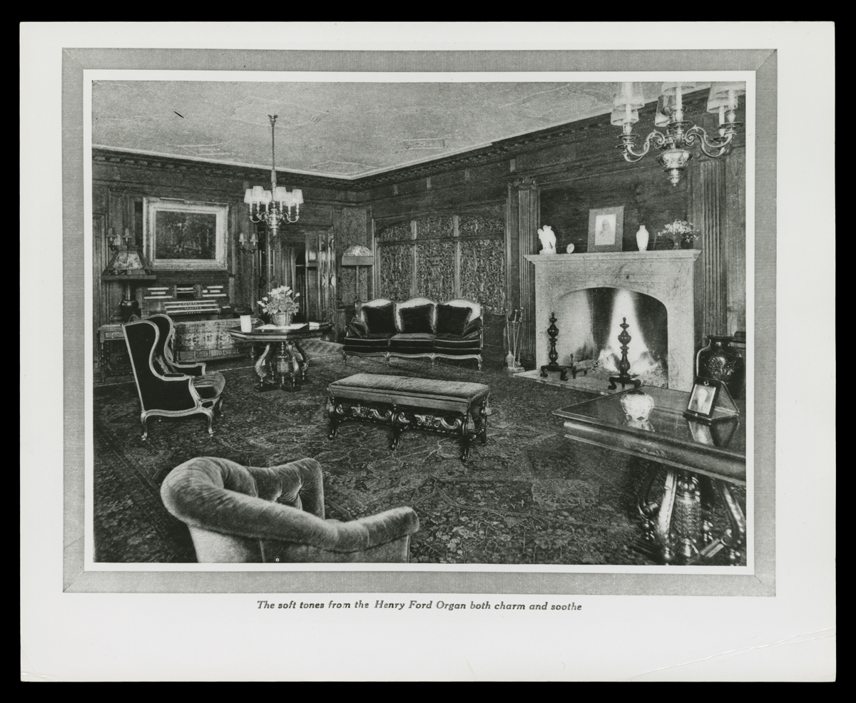 Living Room at Fair Lane, Home of Henry Ford, March 1916 Page with text and photograph or drawing of room interior with carved wood, fireplace, and upholstered furniture