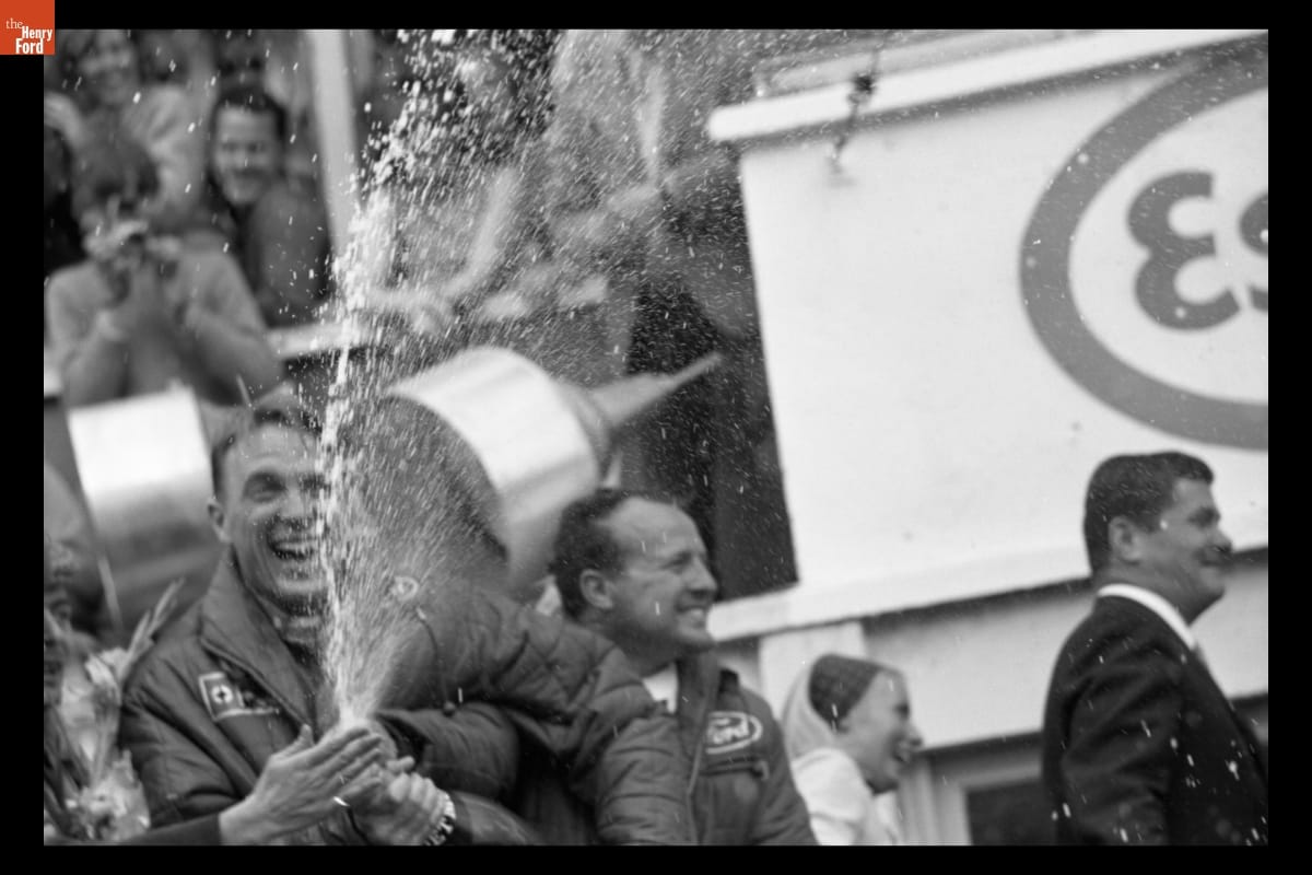 thf127983 Gurney spraying champagne after victory.