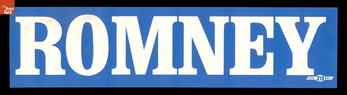 Blue bumper sticker with white text “ROMNEY”