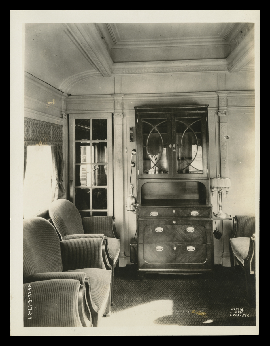 Interior of Henry Ford's Private Railroad Car, Interior of room with two upholstered chairs and dresser with cabinet above