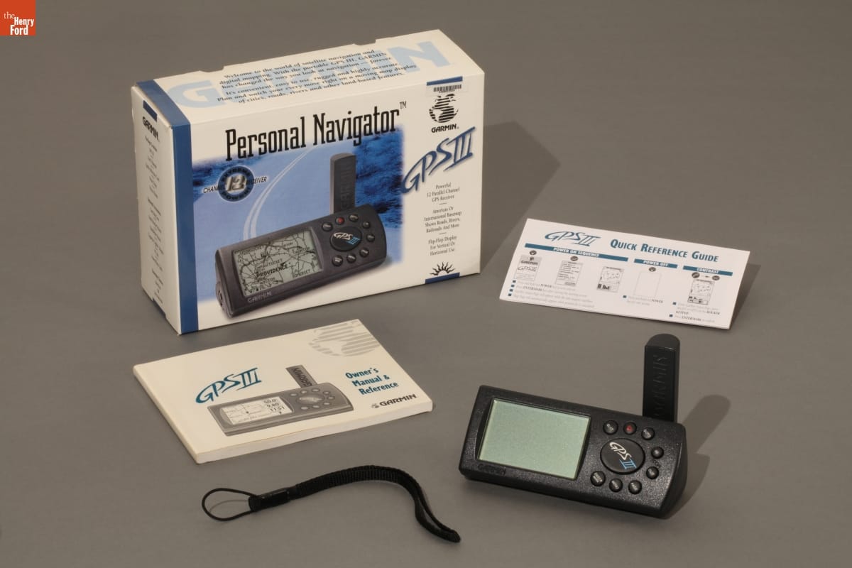 Garmin Small electronic device, cord, instruction manual,