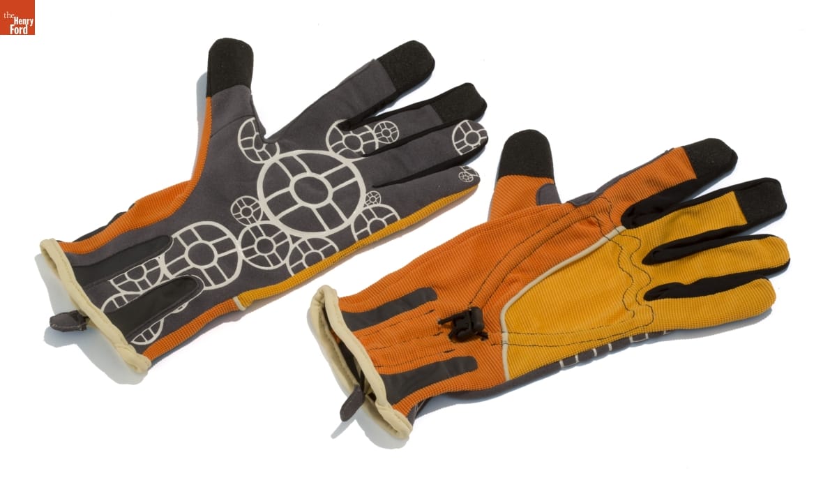 NordicPul: All-Weather Women's Work Gloves, 2010 Gloves that are half yellow and half orange on back and gray with white pattern of circles or gears on palms