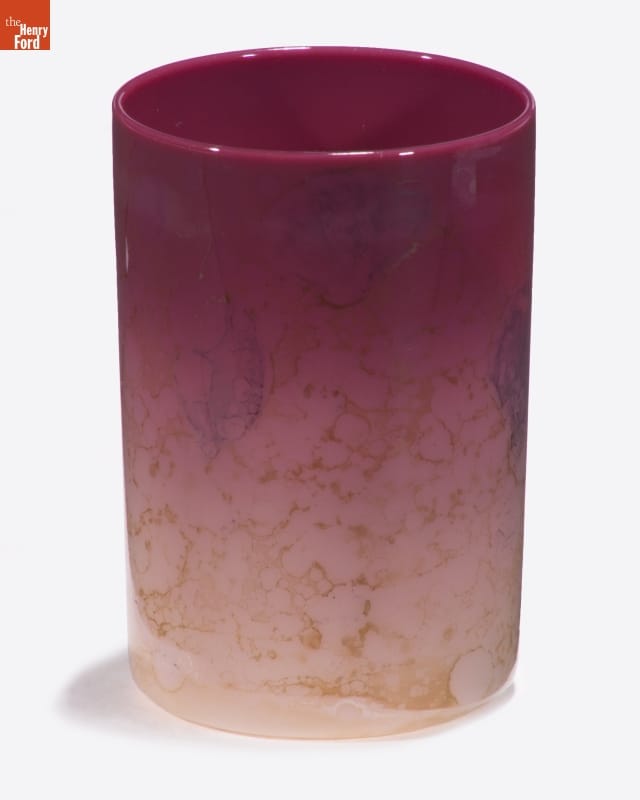 Glass with gold marbled pattern, morphing in color from beige at the bottom to dark pink at the top
