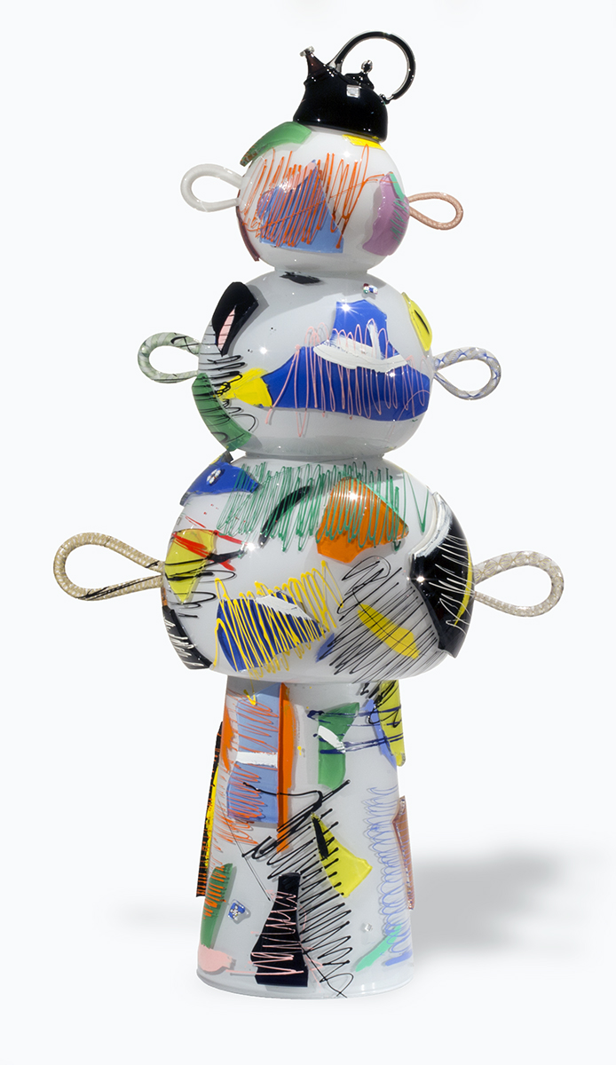 Multicolored artwork with a base topped by three progressively narrower spheres/ovals with a protruding loop on each side, with a teapot-shaped crown on top