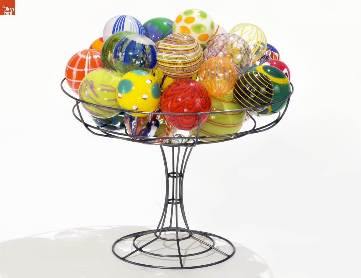 Colorful glass balls are stacked in wire