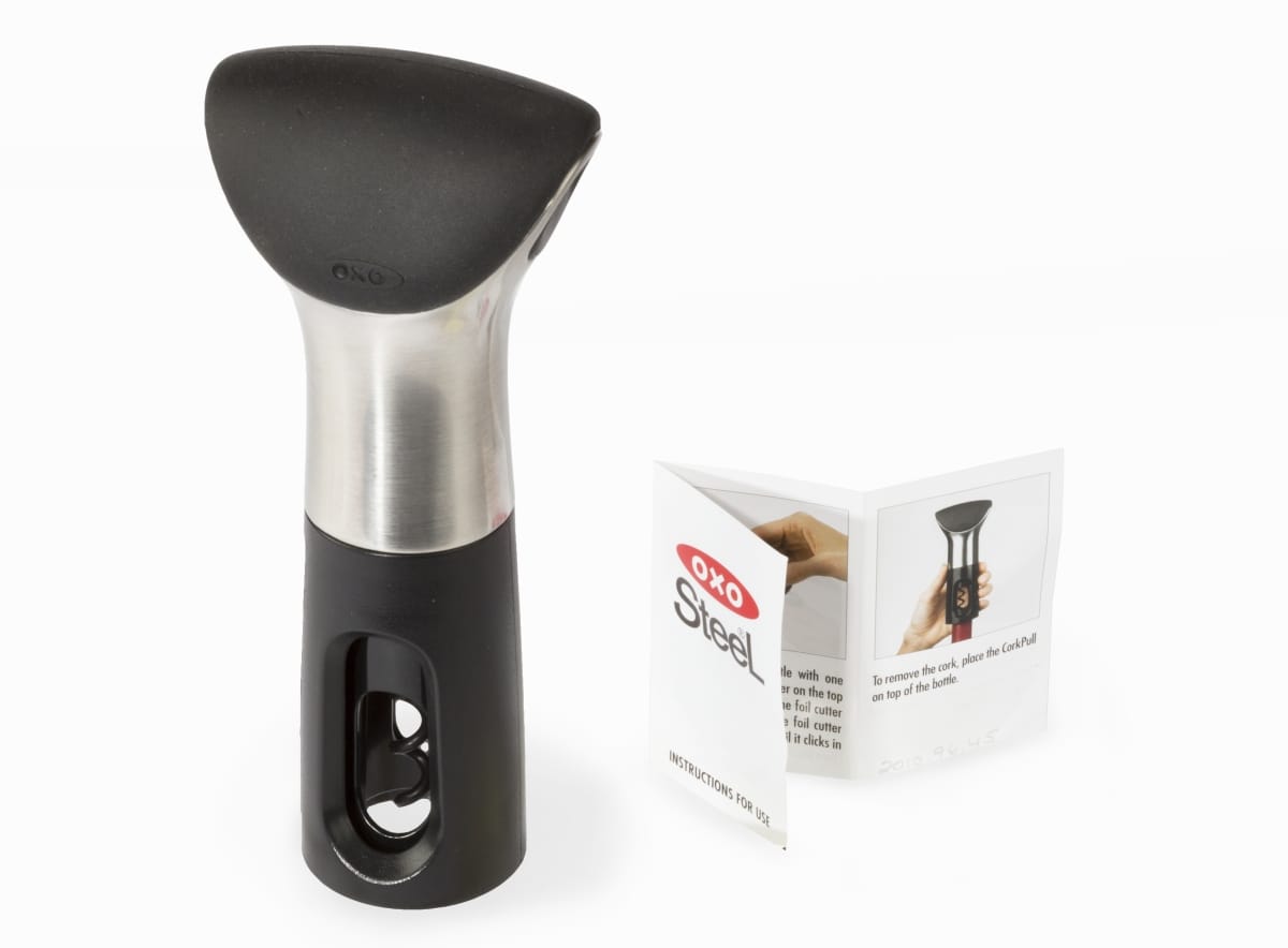OXO SteeL CorkPull, 2010 Sleek black plastic and silver metal device with folded instruction sheet