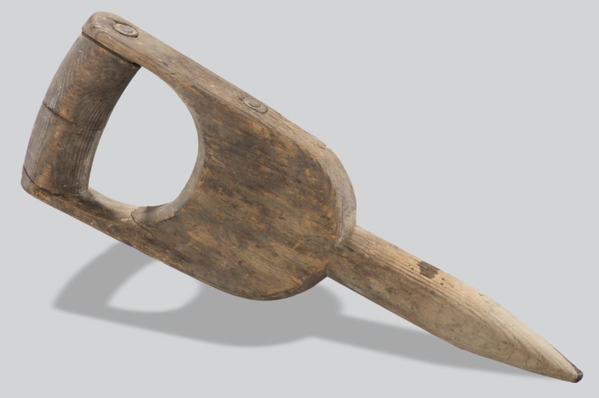 Dibble, circa 1910 Wooden implement with broad handle and pointed end