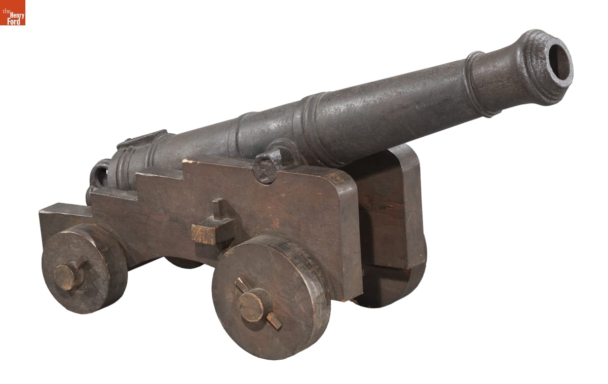 Naval Cannon, circa 1780 Metal cannon with some decorative banding, mounted on a metal (?) cart