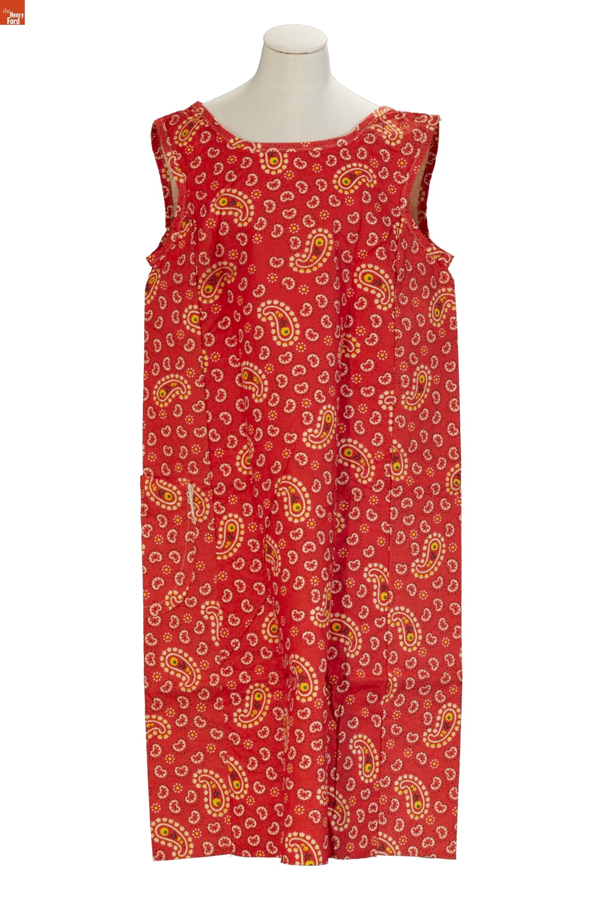 Red sleeveless shift dress with yellow paisley pattern