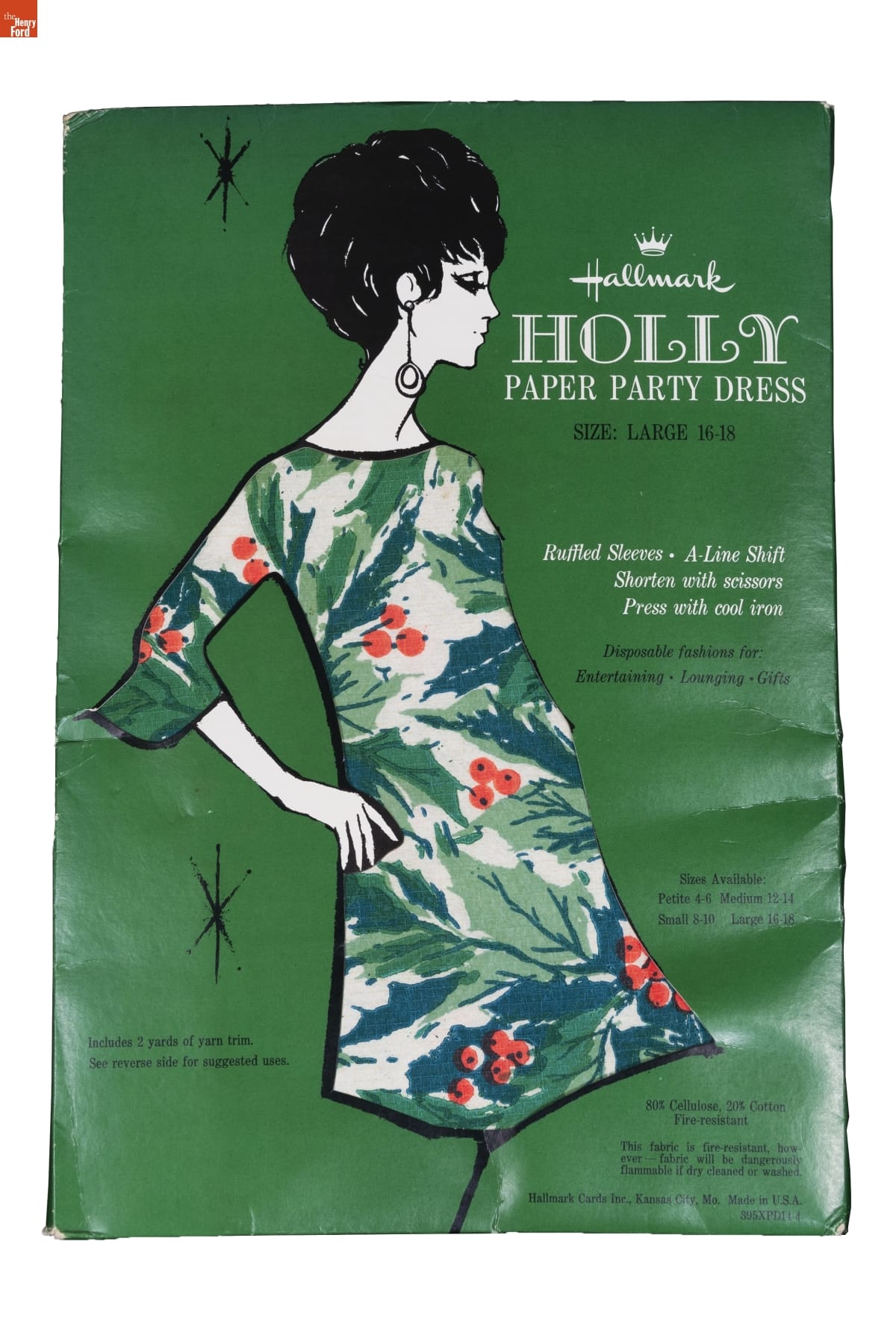 Green package with drawing of woman with pink hair, wearing multicolored floral dress; also contains text