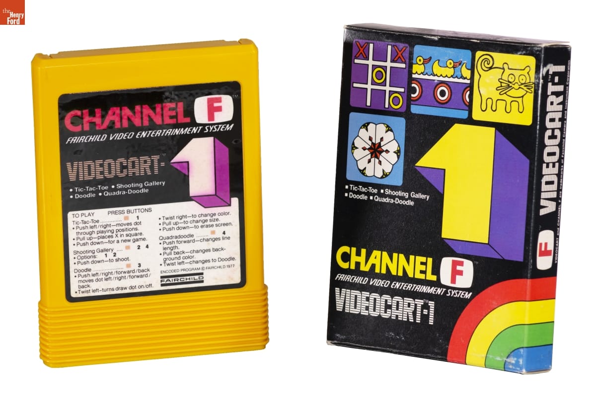 airchild Videocart-1 Game, Boxy yellow game cartridge with graphic label containing text, next to black box with graphics and text