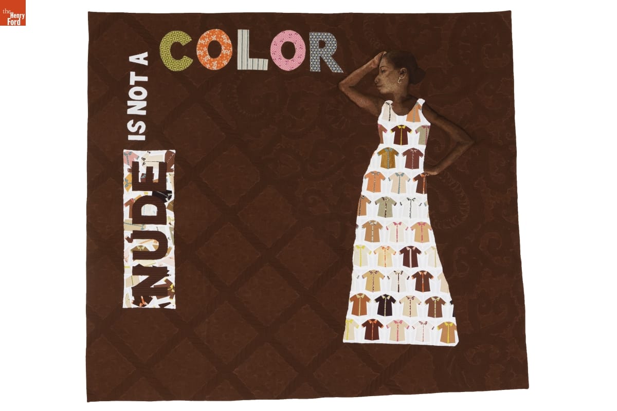 Brown quilt with text 