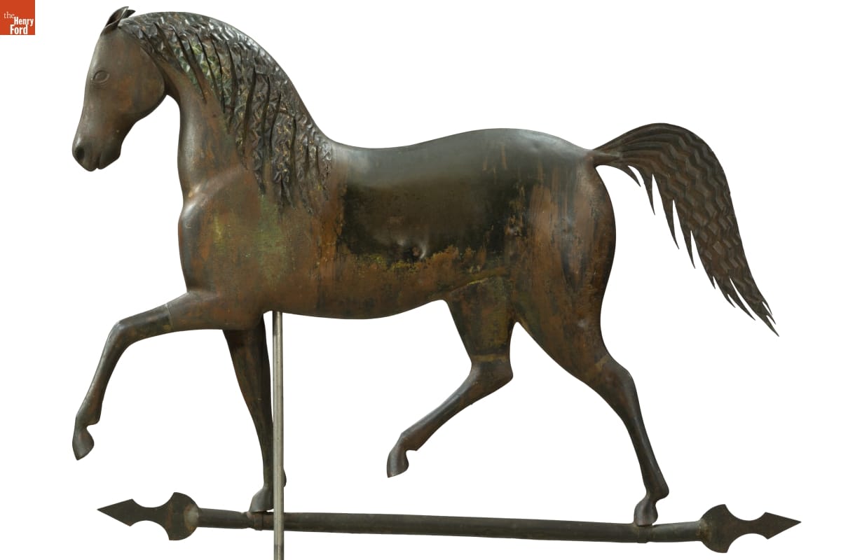 Metal sculpture of horse with crimped mane and tail
