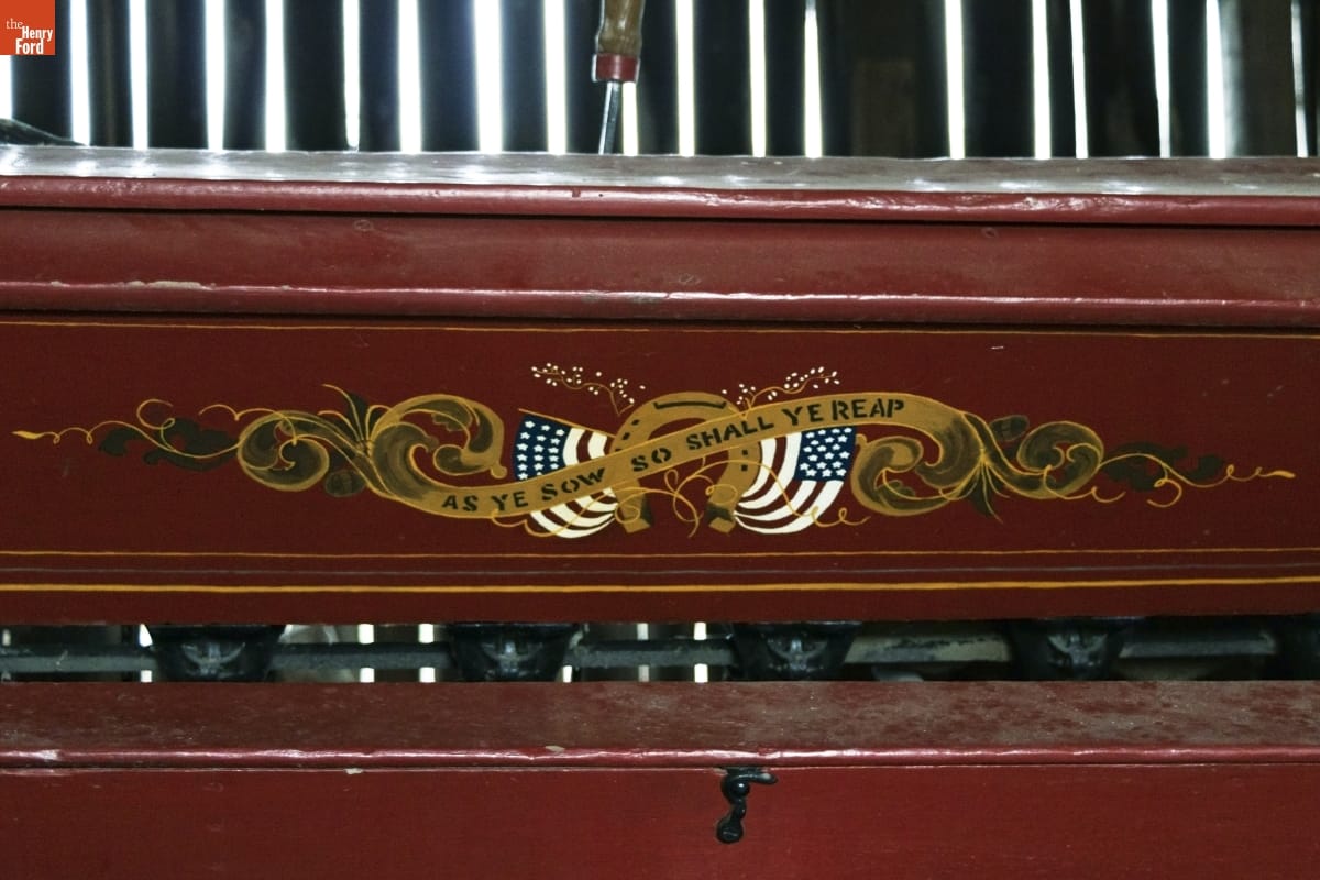 Brown or maroon wooden equipment with text 