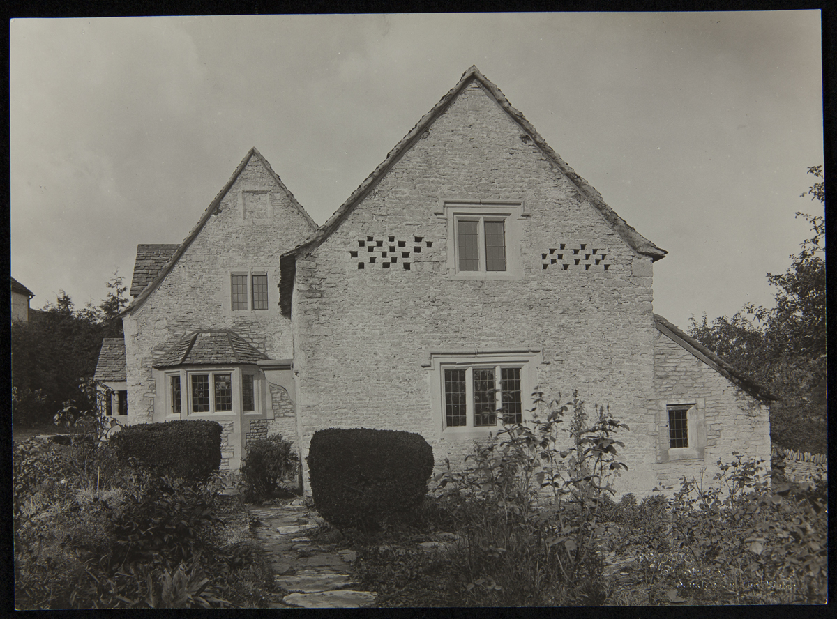 Exterior of Cotswold Cottage at its Original Site, Chedworth, Gloucestershire, England, 1929-1930 Stone house with garden