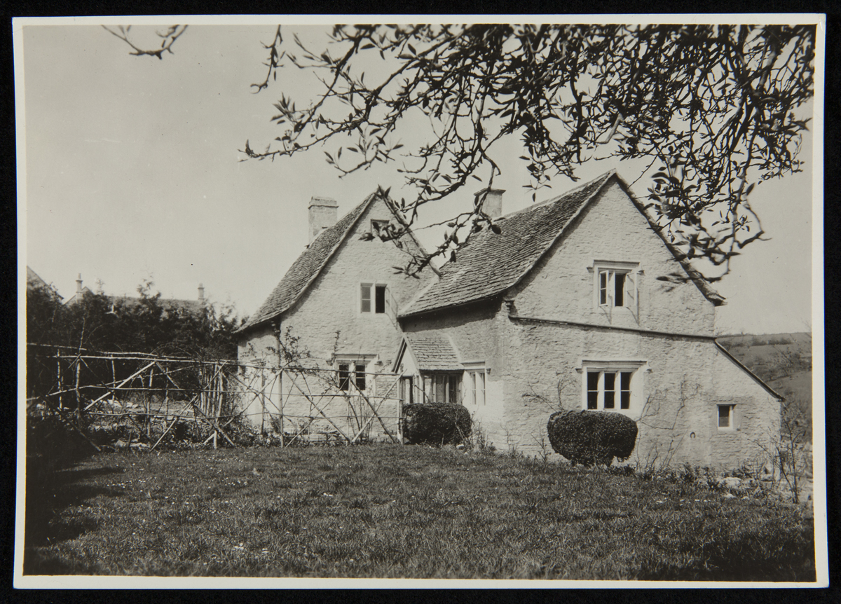 Exterior of Cotswold Cottage at its Original Site, Chedworth, Gloucestershire, England, 1929-1930 Stone building with peaked rooves