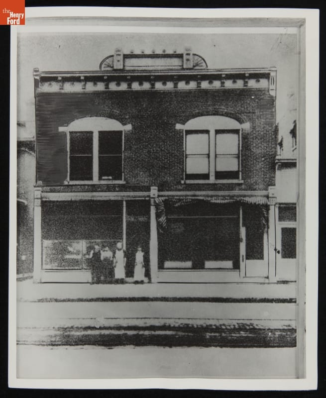 Wright Cycle Shop Building at Its Original Site in Dayton, Ohio, circa 1910 Two-story brick building with sign on top