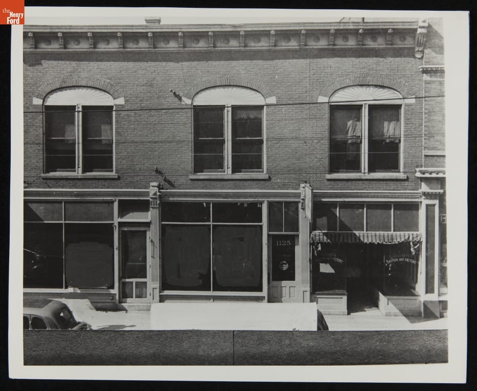 Wright Cycle Shop--Original Site--Exterior Facade of two-story brick building with storefronts on ground floor and windows on second floor