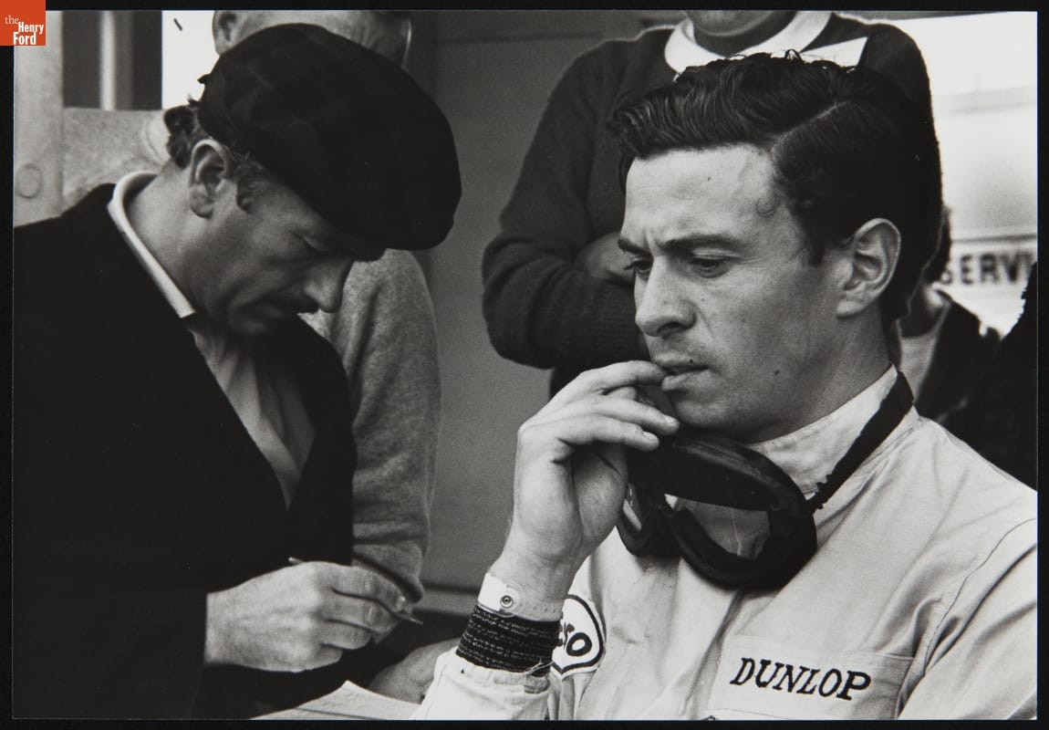 thf241455 Colin Chapman and Driver Jimmy Clark at the 1965 U.S. Grand Prix at Watkins Glen.