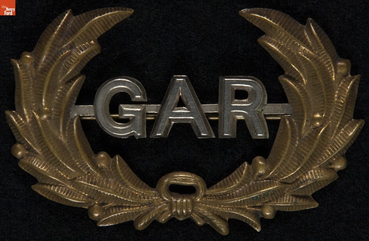 Grand Army of the Republic (G.A.R.) Hat Insignia, 1867-1920 Metal pin with gold laurel and silver letters