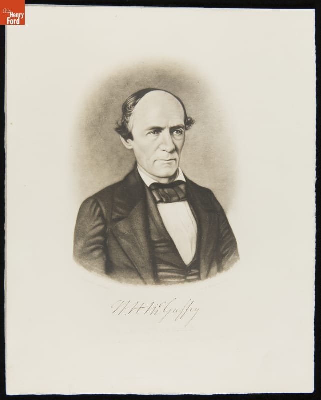 Black-and-white portrait of man with receding hairline wearing suit