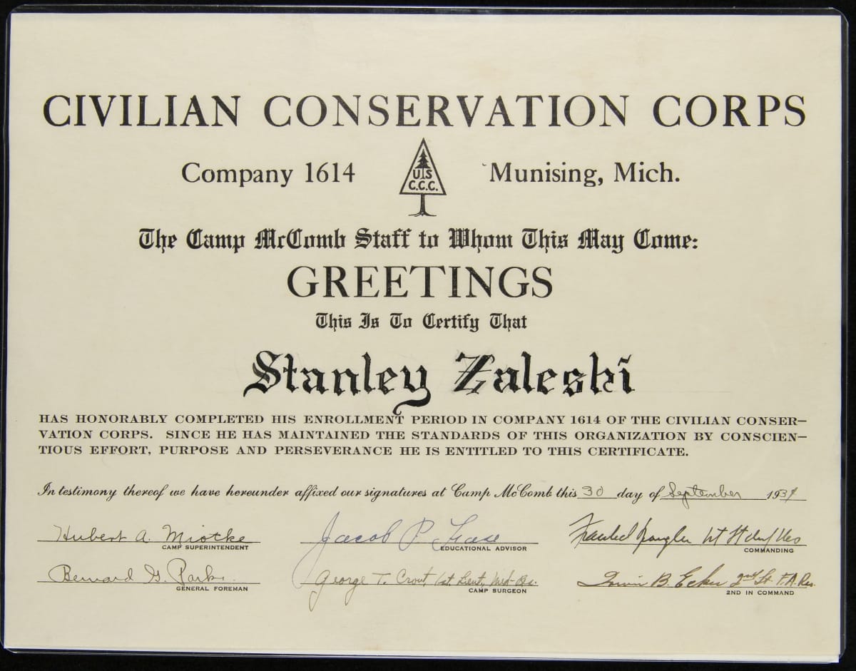 Certificate with printed text and six signatures at bottom