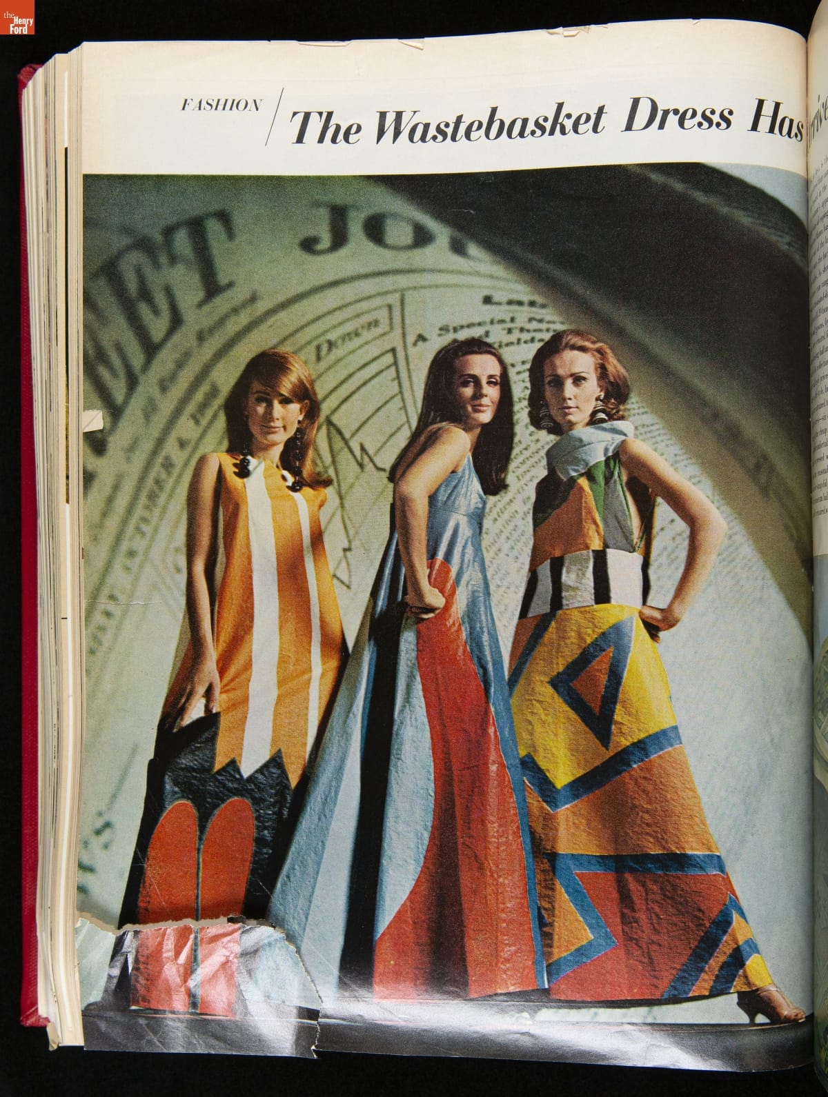 Three women pose in floor-length boldly geometrically patterned sleeveless dresses; styles and colors vary; also contains text