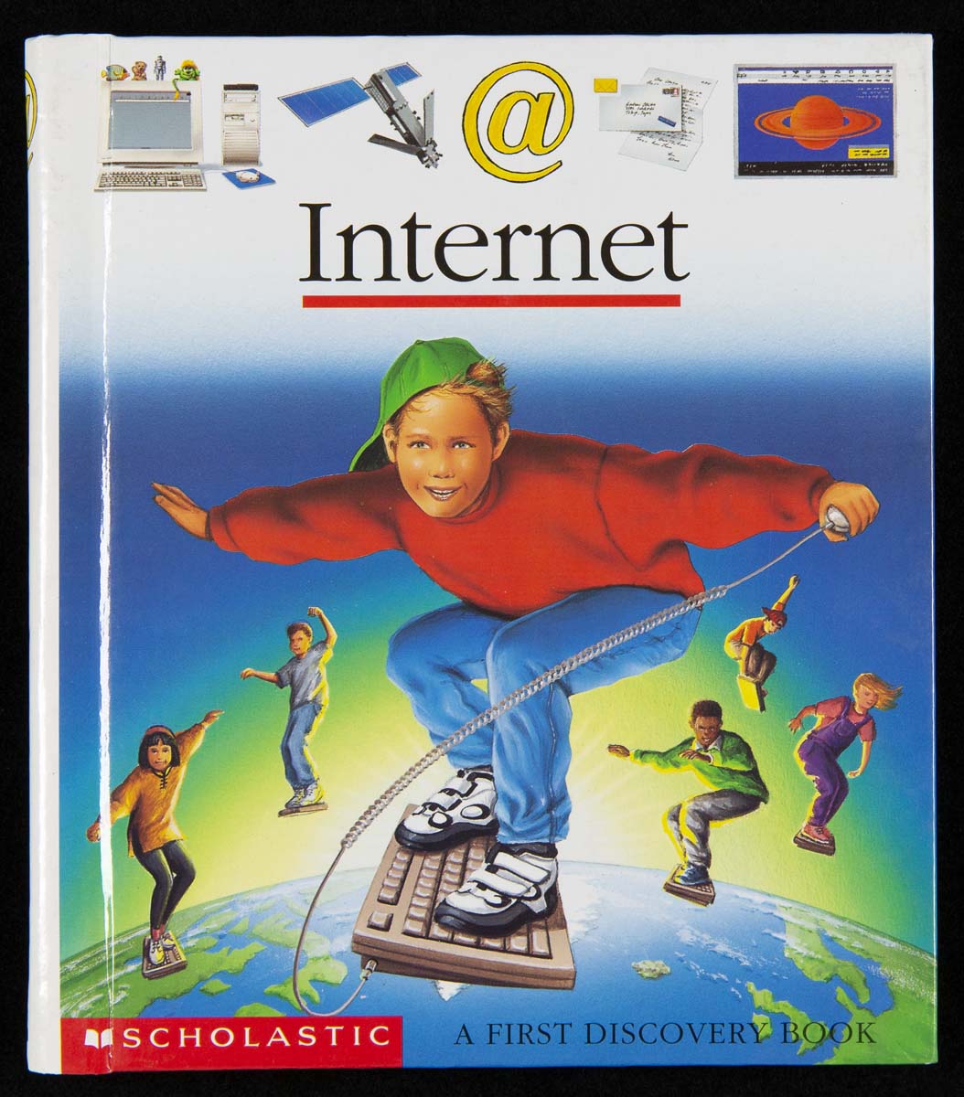 Internet: A First Discovery Book, 2000 Book cover with text, icons, and image of children on surfboards floating above the planet Earth