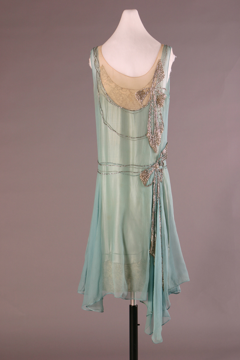 Pale blue and beige dress with beaded bow detailing
