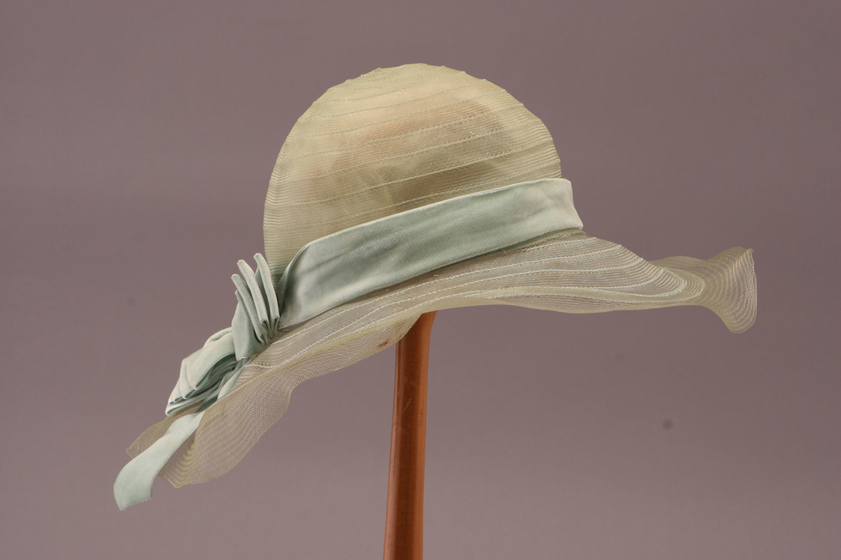 Floppy, delicate beige hat with pale blue ribbon
