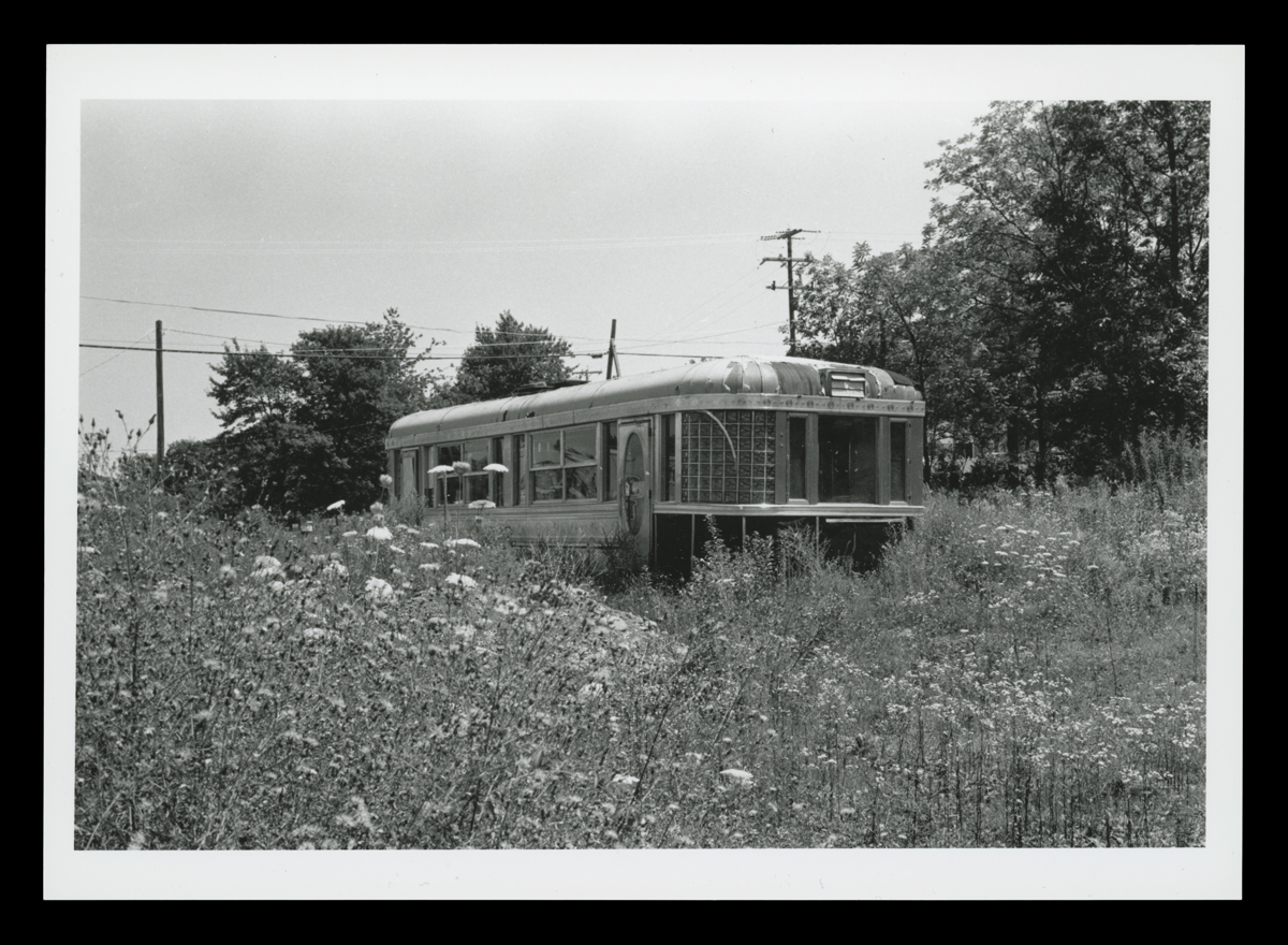The former Uncle Wally's, a 1950 Paramount Roadking model diner in a field, circa 1975.