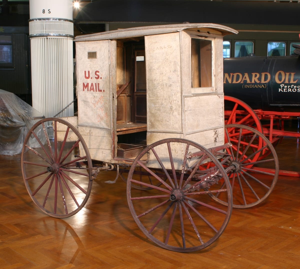 Mail Wagon Used for Rural Delivery in Missouri, 1902-1925 Small, boxy carriage with open doorway and text