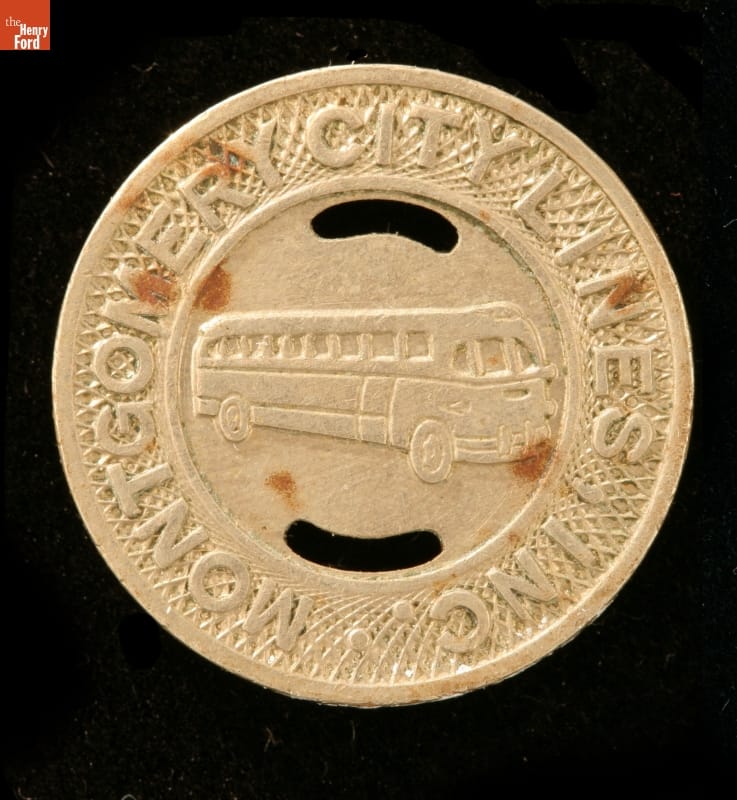 Transportation Token, Montgomery City Bus Lines, circa 1955 Round gold-colored token with text around outside and picture of bus in center