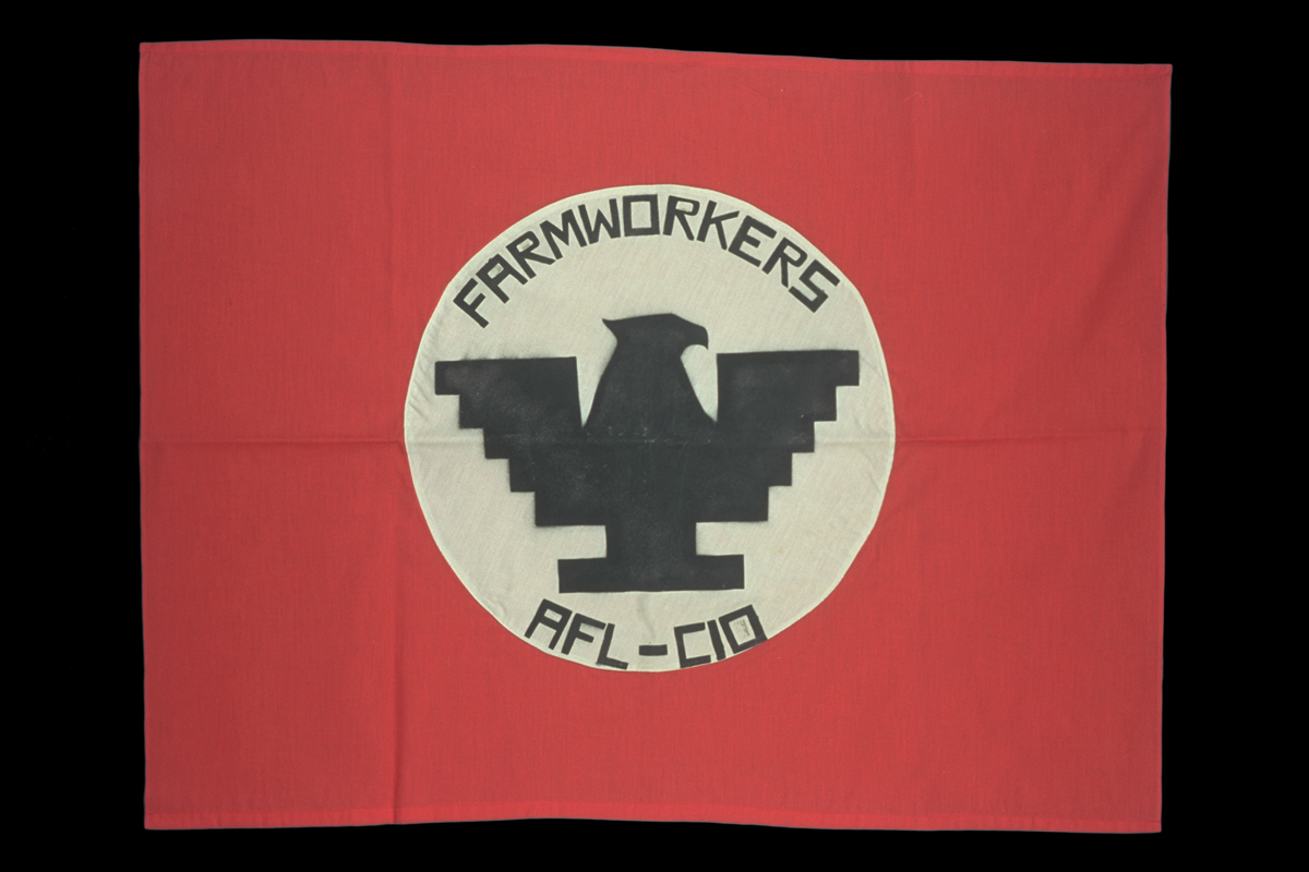 United Farm Workers Flag, circa 1970 Red flag with white circle in middle containing stylized black eagle and text