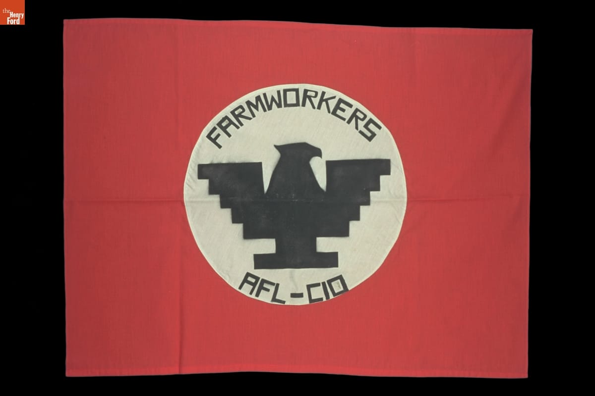United Farm Workers Flag, circa 1970 Red flag with white circle containing stylistic, blocky silhouette of eagle and text