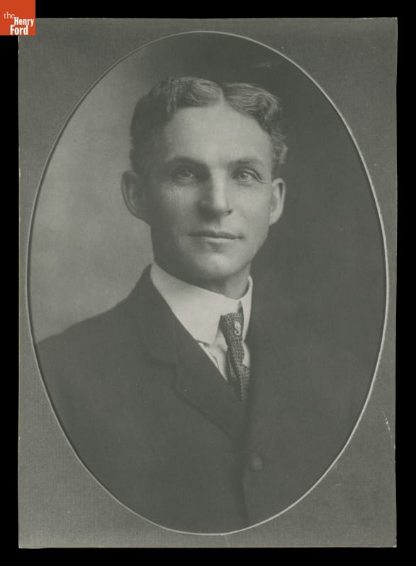 Portrait of man with wavy hair wearing suit